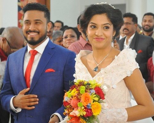 Abish Methew with his wife Arcahna Kavi