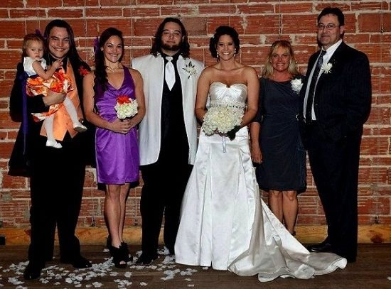 From left to right: Brother Bo Dallas, Sister in law Sarah, Bray Wyatt, Wife Samantha, Mother Stephanie, Father Mike Rotunda (aka IRS)