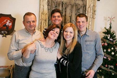 Milos Raonic with parents and siblings