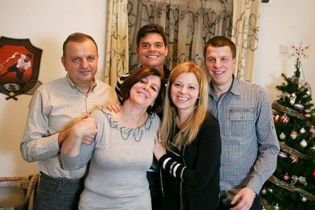 Milos Raonic with parents and siblings