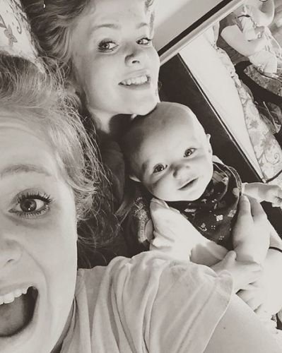 Pippa Hughes with her baby brother and elder sister