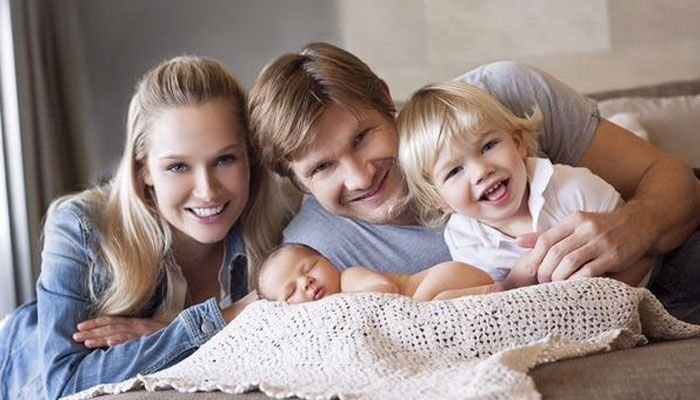 Shane Watson with his wife and children