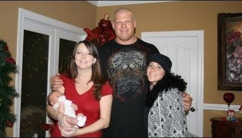 wrestler Kane with his daughters